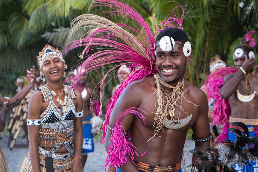 Fula'aro pappipe group member Rick Fairamoa smiles after performing a traditional Mao dance.