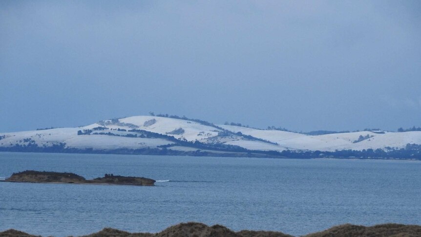 Snow on Clifton beach on Hobart's eastern shore