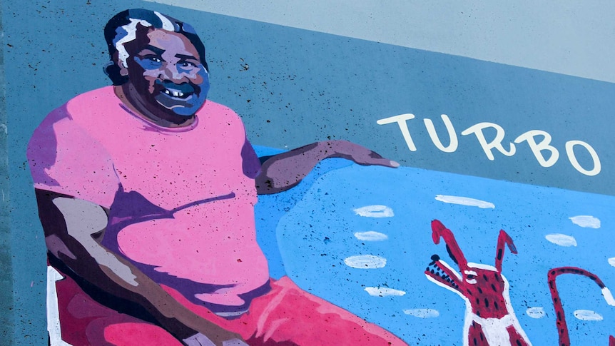 Mural of the artist Turbo Brown, his artwork, and his name, painted on a street wall in Brunswick, Melbourne.