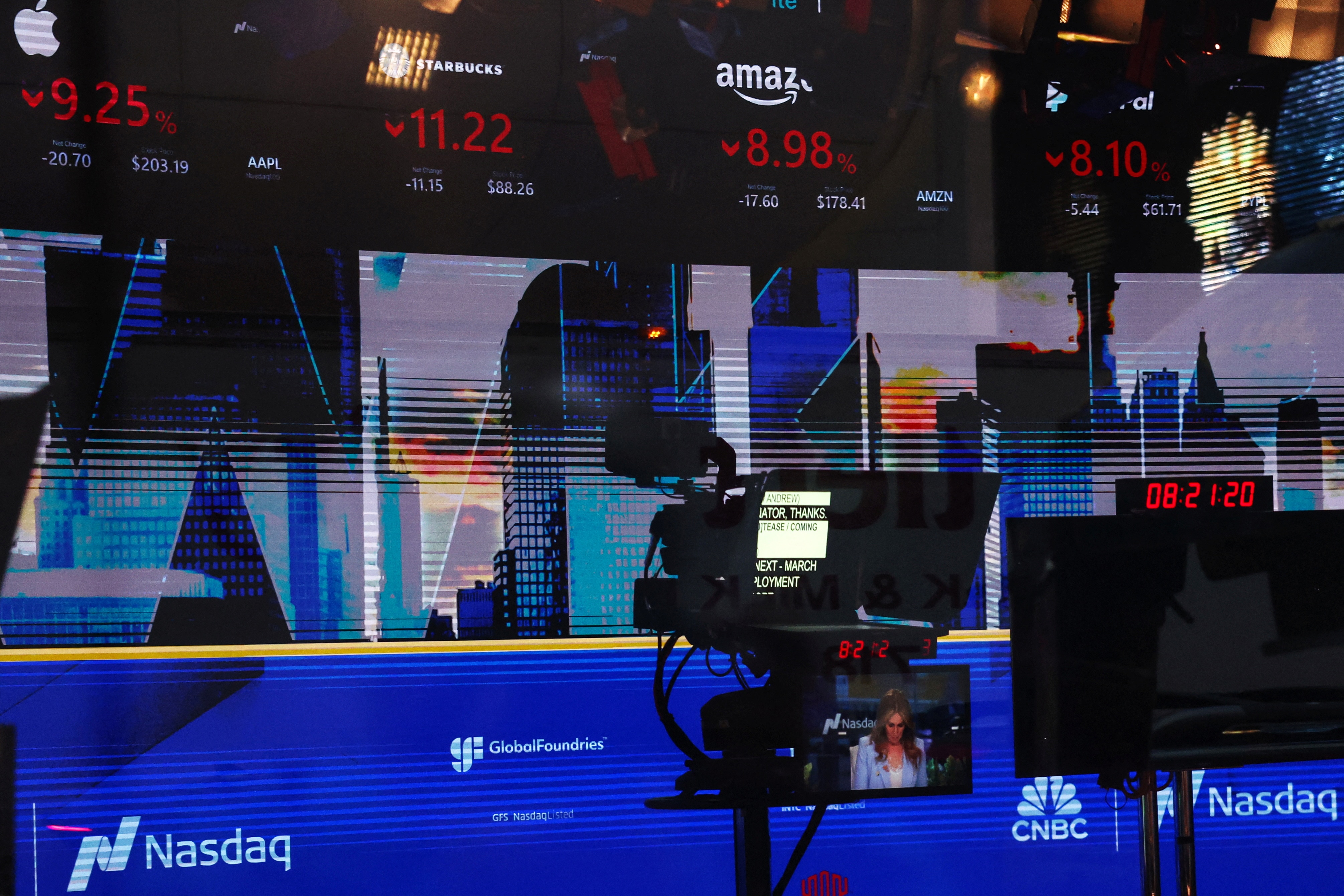 Screens show big tech stocks falling