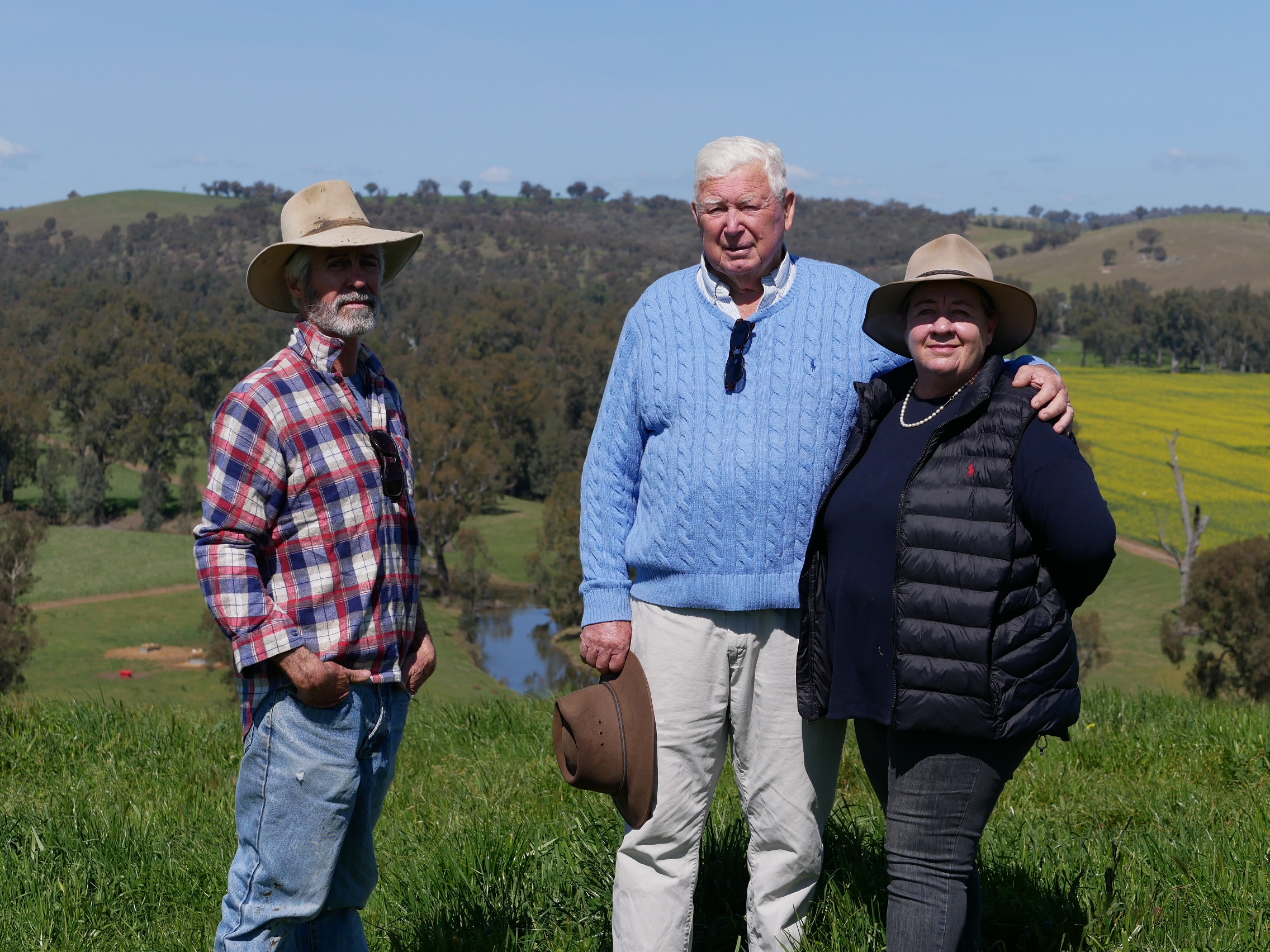 Three people in a field