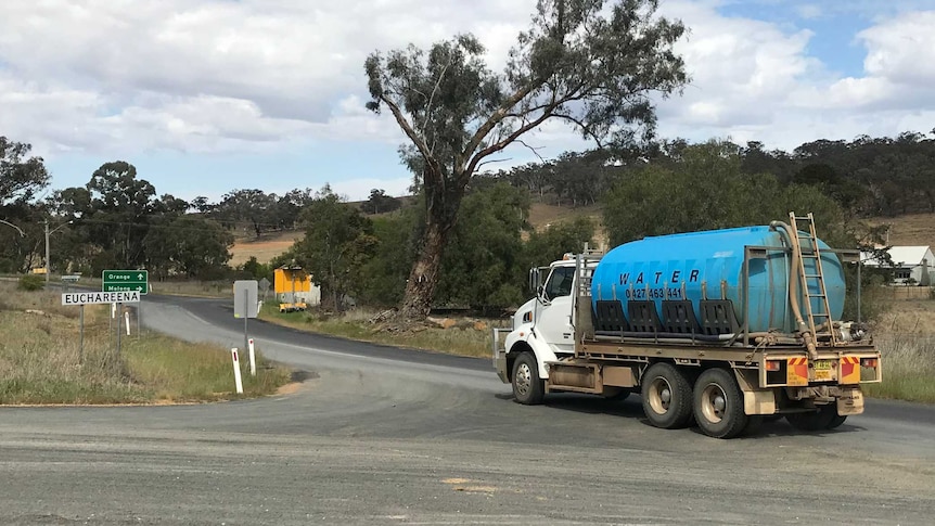 A truck carrying thousands of litres of water arrives in Euchareena to be delivered to a family.