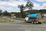 A truck carrying thousands of litres of water arrives in Euchareena to be delivered to a family.