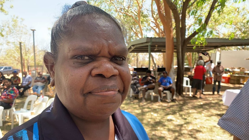 Lisa Mumbin stands in front of the camera in a blue shirt at Nitmiluk.