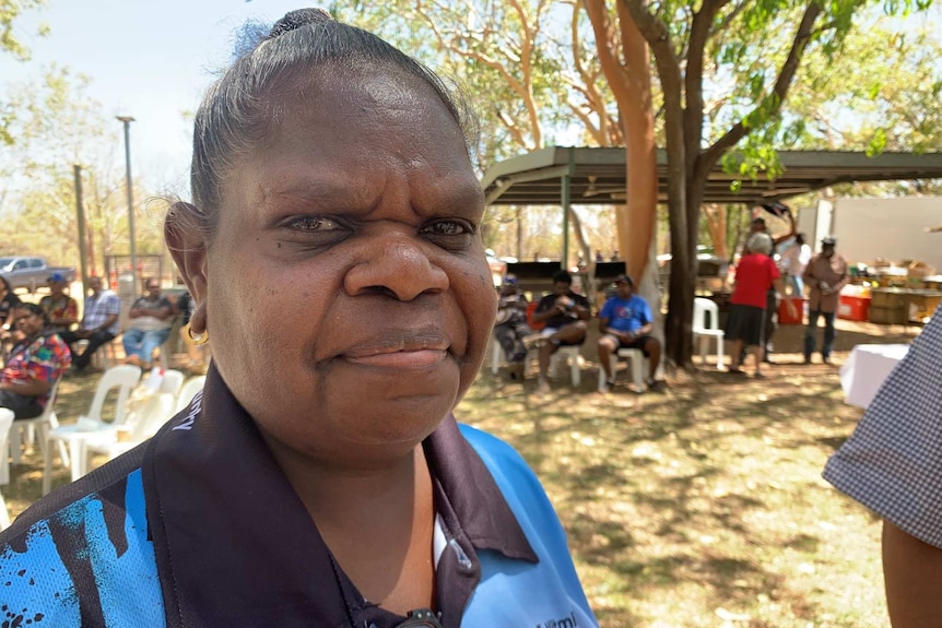 Lisa Mumbin stands in front of the camera in a blue shirt at Nitmiluk.