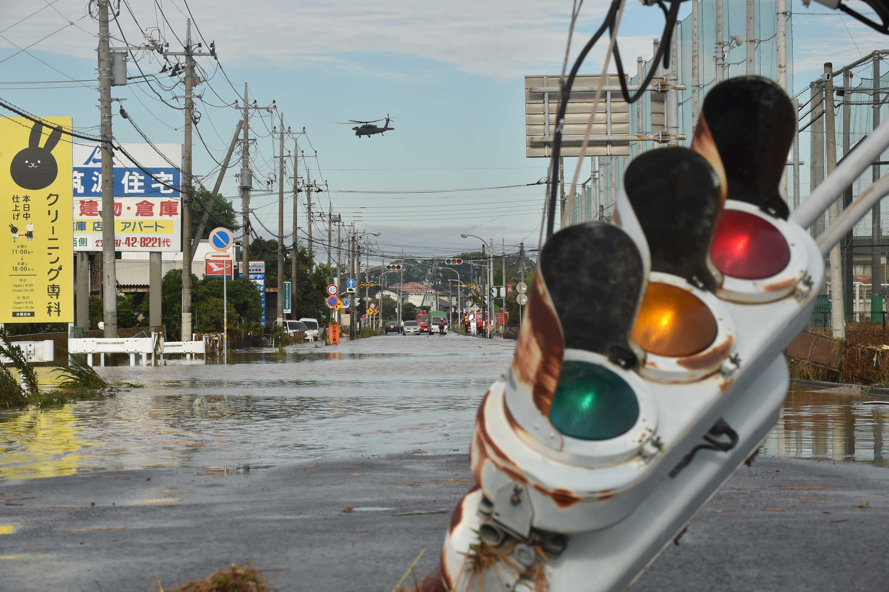 Japan Floods More Than 100 000 Flee After Torrential Rain Unleashes Flooding People Rescued From Roofs In Joso City Abc News