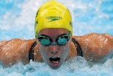 An Australian female swimmer competing in the heats of the 100 metres butterfly at the Tokyo Olympics.