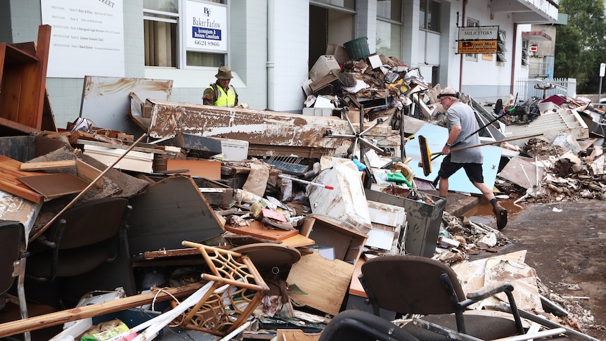 ADF personnel clean up after flood