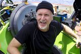 James Cameron emerges from the DEEPSEA CHALLENGER after travelling to the bottom of the ocean.