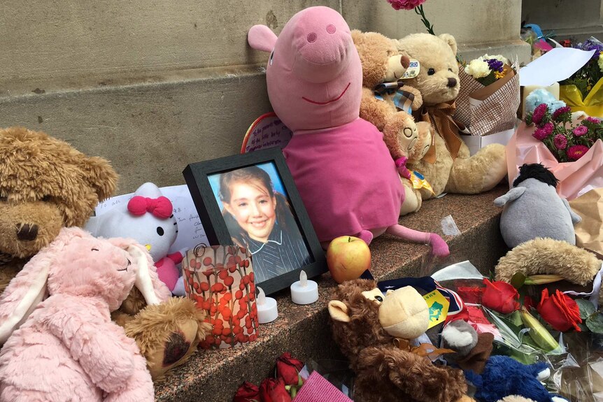 A photo of 10-year-old Thalia Hakin at a memorial for the victims of the Bourke St car attack.
