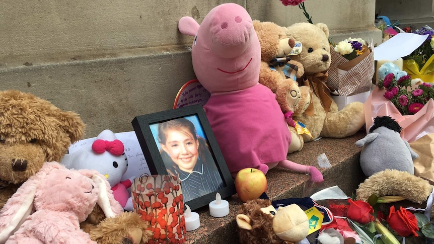 A photo of 10-year-old Thalia Hakin at a memorial for the victims of the Bourke St car attack.