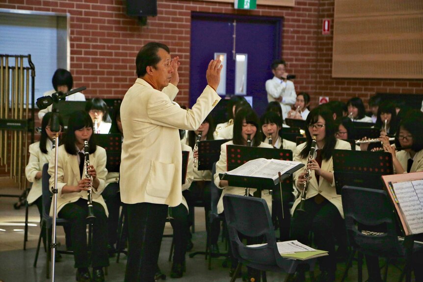 Musical director Tani Kiyotaka from Ichijo High School in Japan.