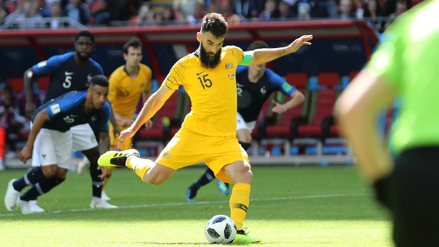 Mile Jedinak converts Australia's penalty against France