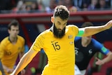 Mile Jedinak converts Australia's penalty against France