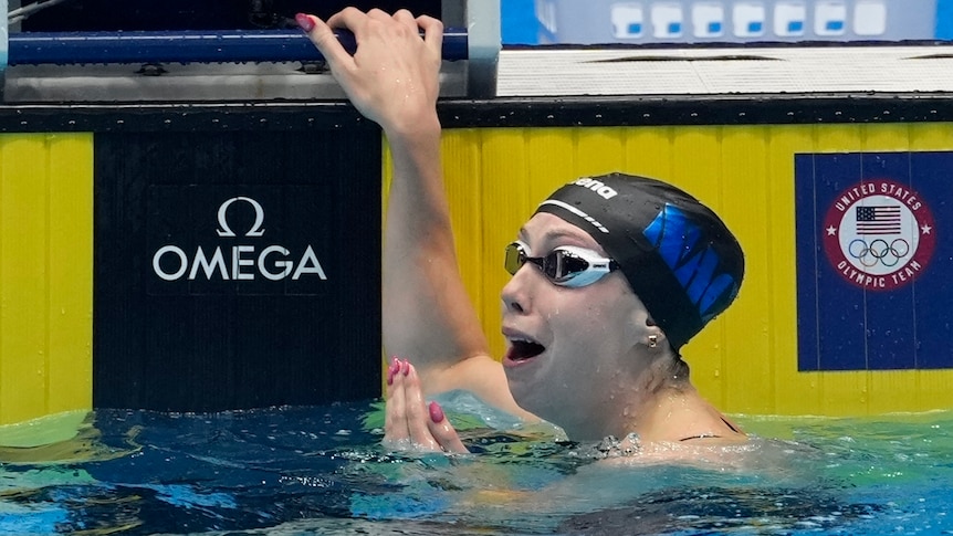 Gretchen Walsh reacts after breaking the world record in the women's 100m butterfly.