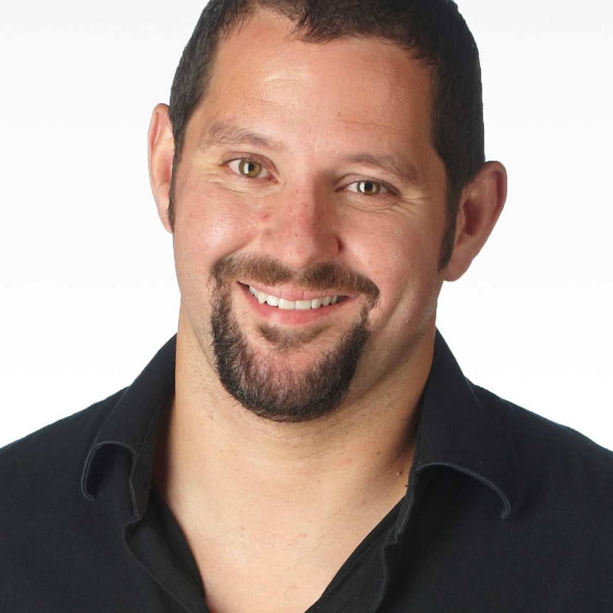 A profile image of a man with short dark hair and a beard, wearing a black shirt.