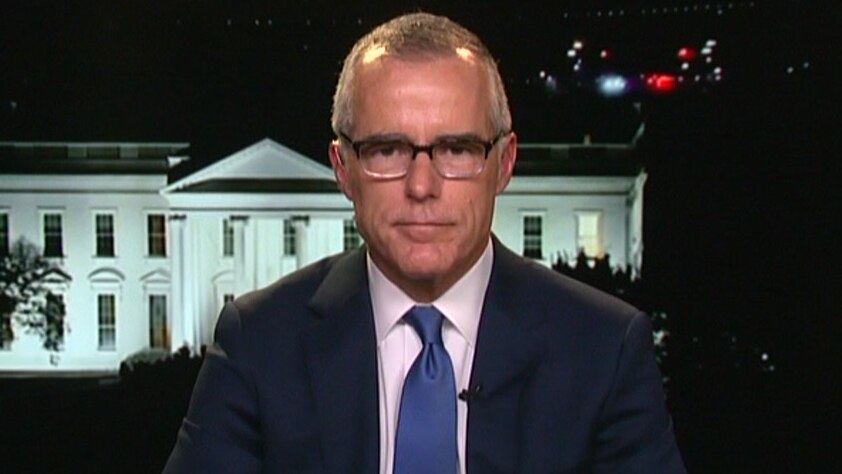 Andrew McCabe talks to 7.30 with the White House in the background.