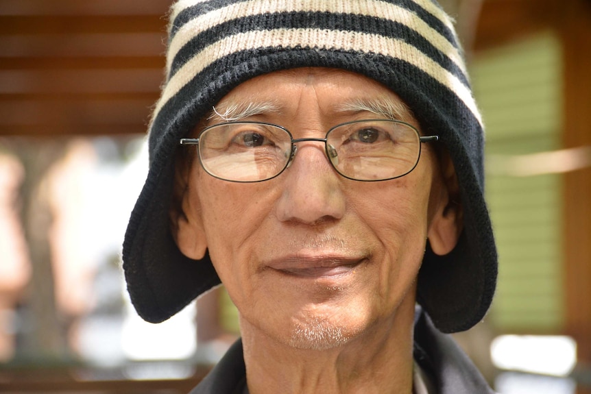 Close up shot of man with a beanie on.