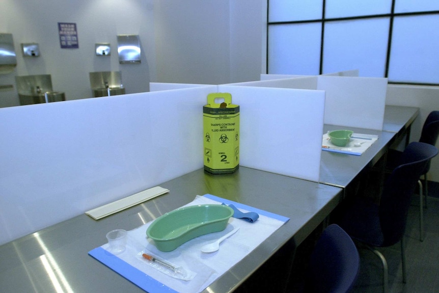 Drug paraphernalia sits on a table in a safe injecting room.