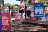 Red and blue election signs