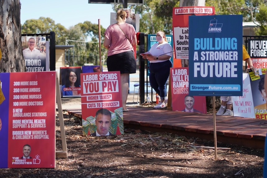 Red and blue election signs