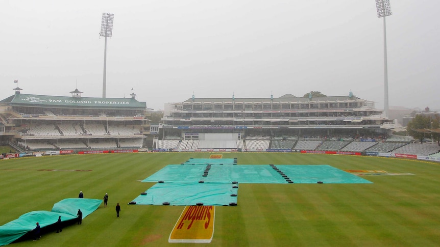 The covers go on at Newlands on day two of the third Test between Australia and South Africa.