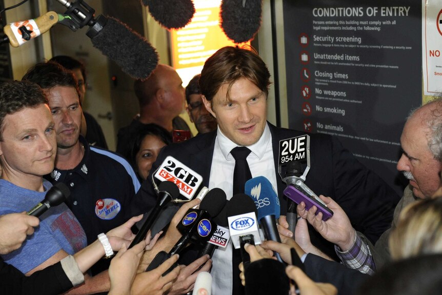 Shane Watson meets the press at Sydney Airport (AAP Image: Mick Tsikas)