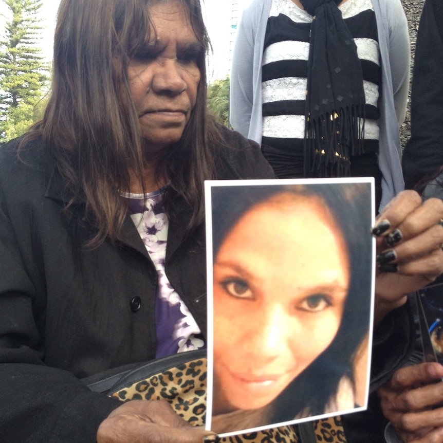 Ruby Kickett holding a picture of her murdered daughter Colleen Ford