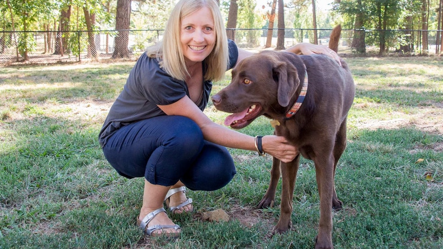 Dog owner with dog at park