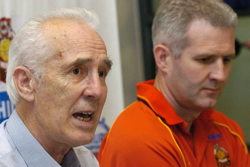 Lindsay Gaze sits next to son Andrew Gaze as they announce their retirement from basketball and the Melbourne Tigers.