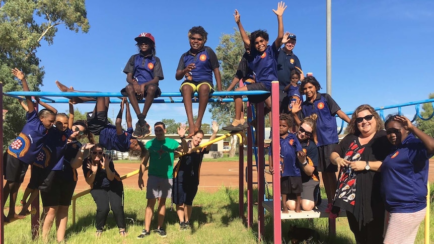 Aboriginal kids play on climbing gear