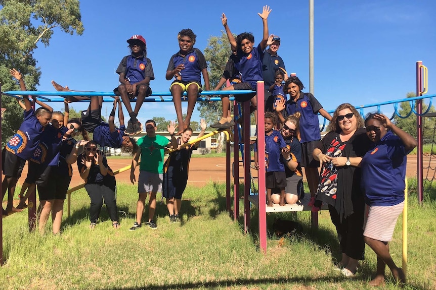 Aboriginal kids play on climbing gear