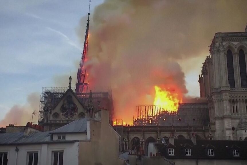 Fire engulfs the roof of the Notre Dame cathedral in Paris.