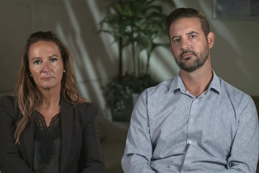 Ray Daniels children, Nicola Amos and John Daniels, sitting next to each other on separate chairs