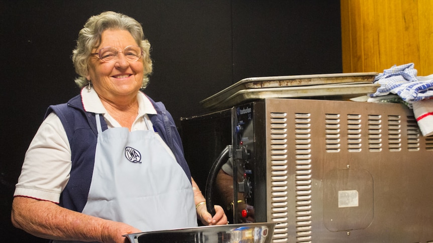 CWA member Val Knight is one of the valued scone bakers who sits by a small oven and makes scones daily by hand.