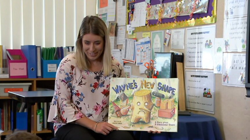 Meg Sampson reads Wayne's New Shape to students.