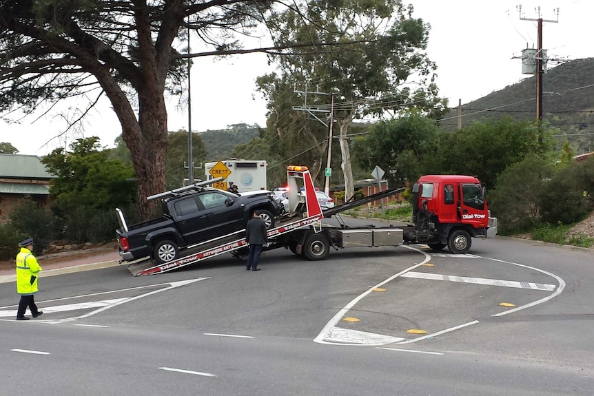 Police investigate the car the injured boy was in