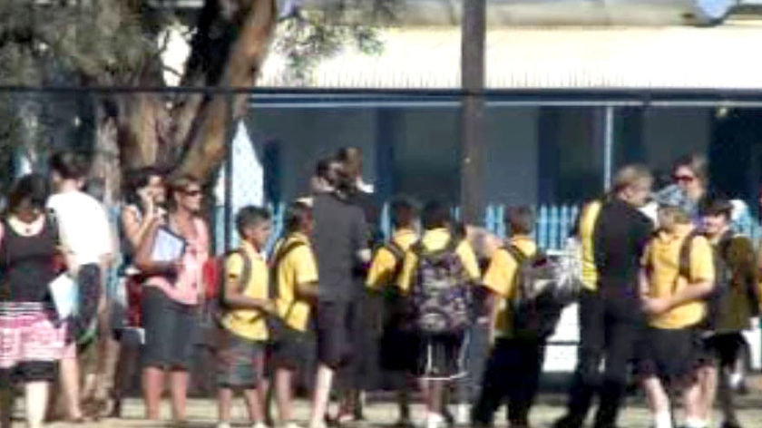 Students gather outside Boulder Primary School after the earthquake