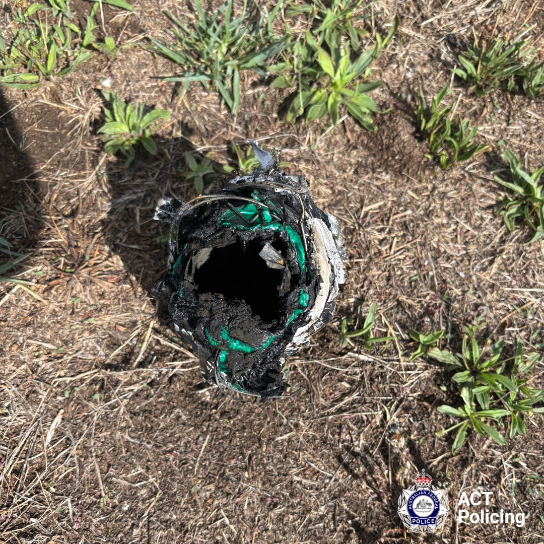 The burnt out remains of what appears to be a homemade explosive.