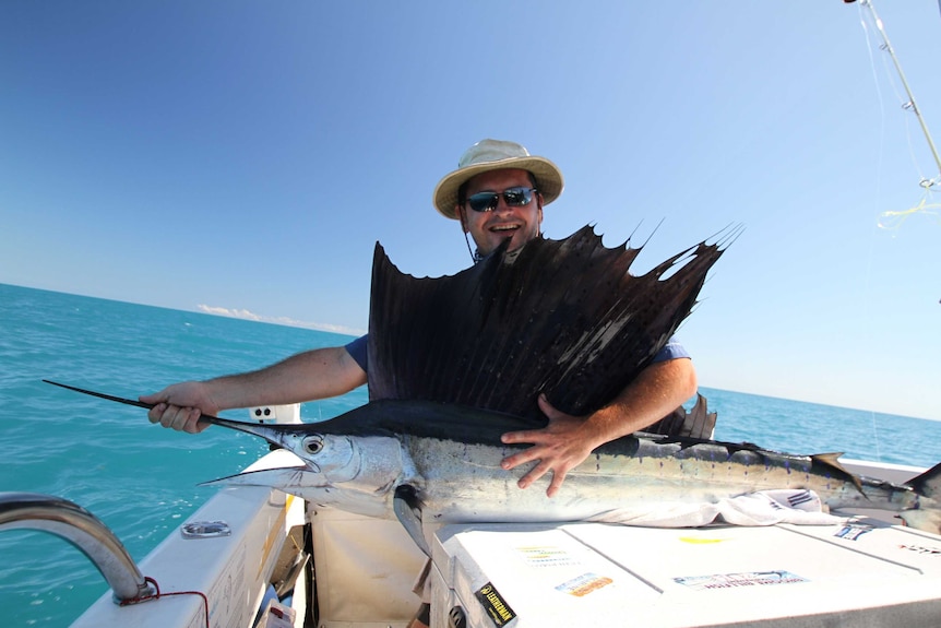 Adam Vincent catches a sailfish off the coast of Broome