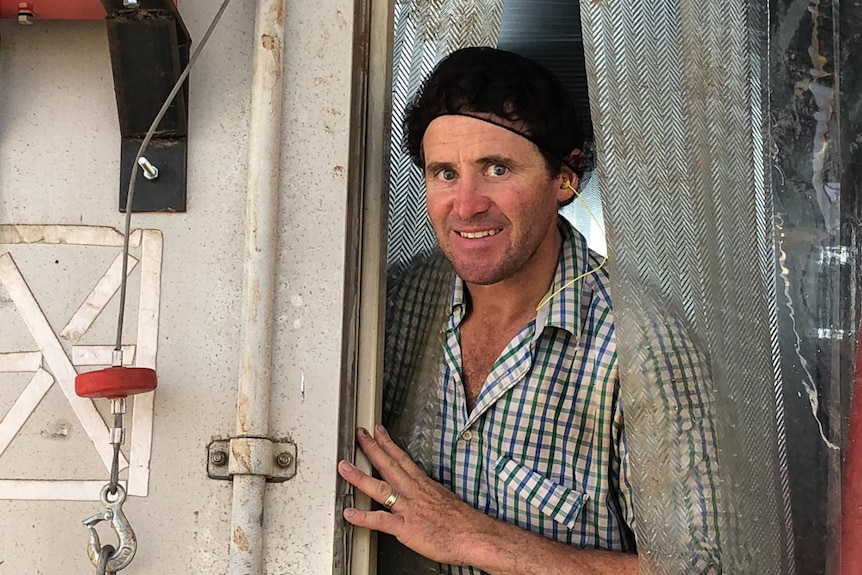 Michael Hicks at the door of his prototype mobile abattoir on his farm.