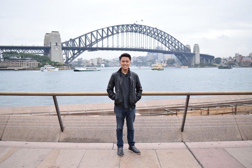 Mario Johan Hartono poses in front of the Sydney Opera House. 