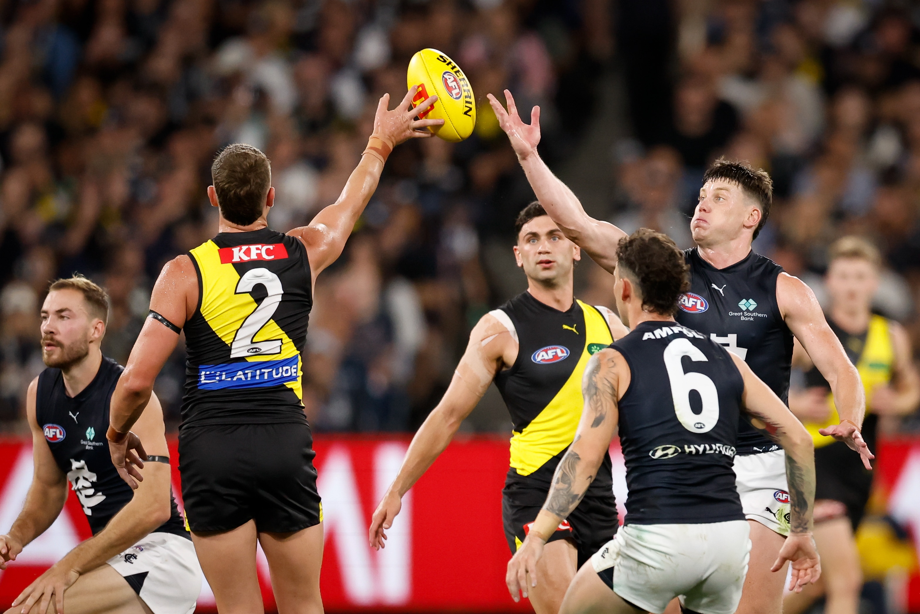 Live: Blues and Tigers ignite first full round of AFL season at packed MCG