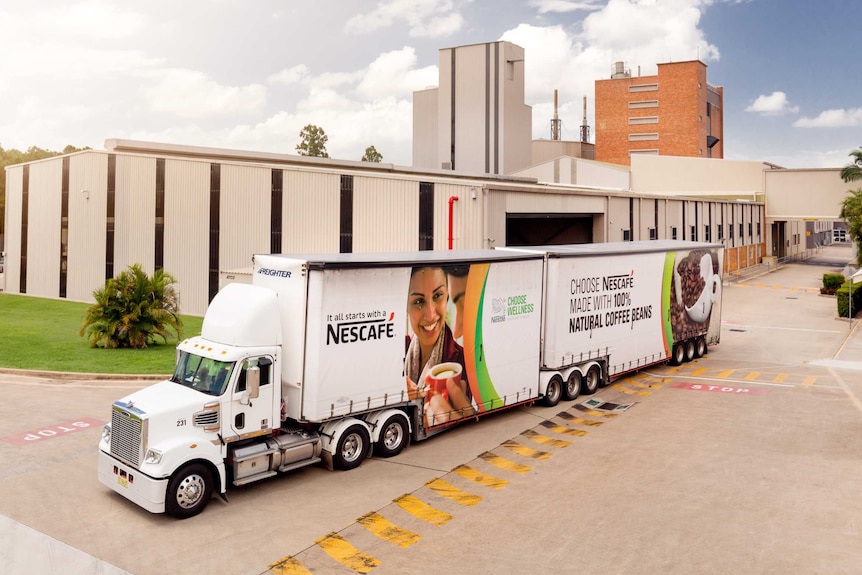 An aerial shot of a Nescafe truck leaving the Gympie Nestle factory