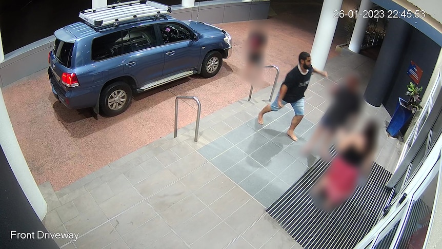 A CCTV still showing the one-punch assault outside the front doors of a hotel.