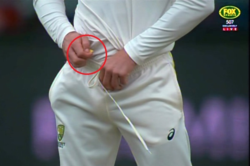 Screengrab of Cameron Bancroft holding a yellow object
