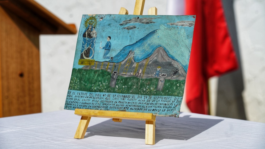 A painting by a Mexican worker displayed on an easel. 