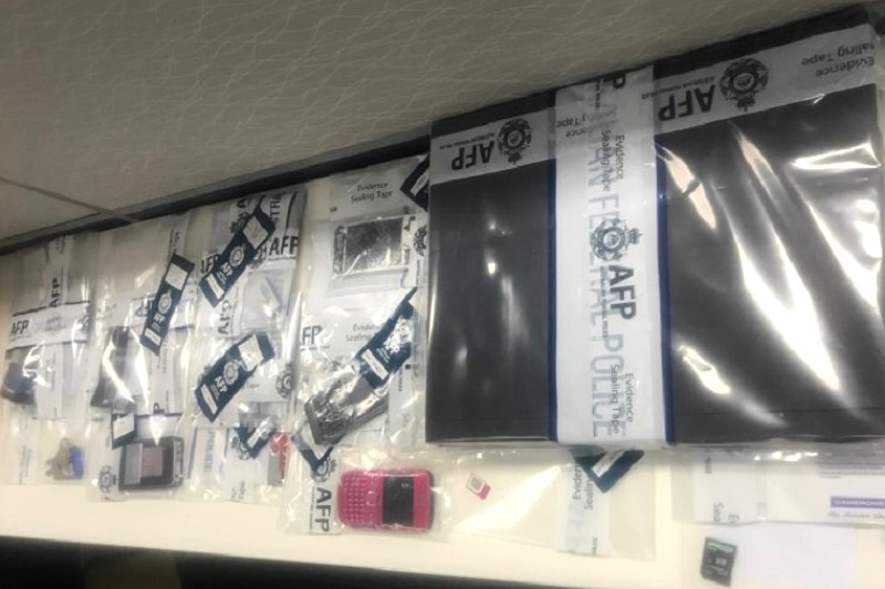 Items in plastic bags marked with the AFP logo