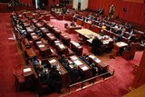 Aerial shot of politicians in the senate chamber