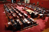 Aerial shot of politicians in the senate chamber
